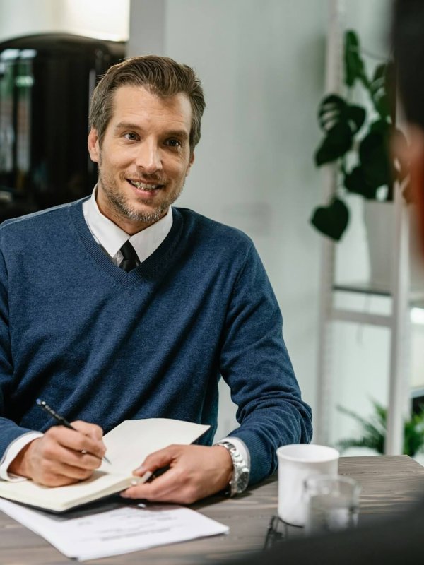 Financial consultant planning home finances with his client.