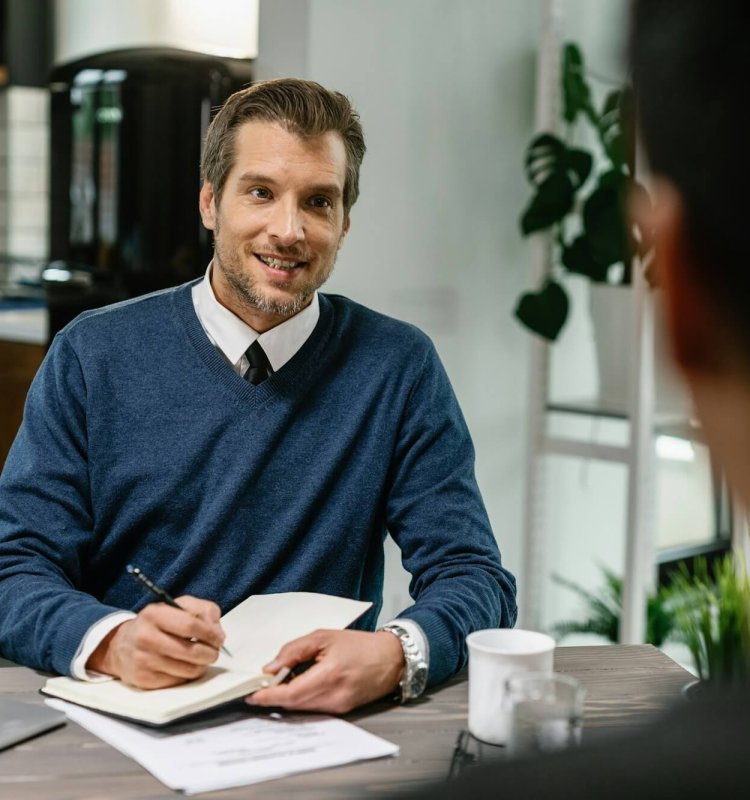 Financial consultant planning home finances with his client.