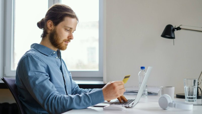 Employee data privacy at work. Booking and purchasing with credit card online at workspace
