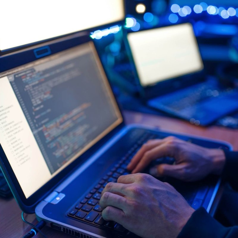 Programmer hands on keyboard, network security