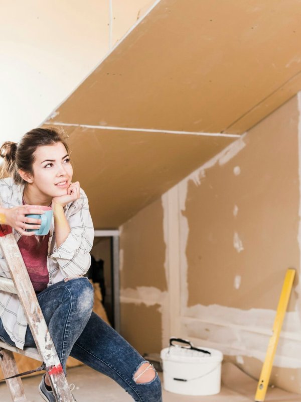 Young woman contemplating the renovation of her new home